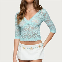 Close-up of blue lace v-neck 3/4 sleeve crop top