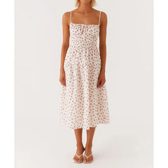 Woman wearing a white floral dress on a white background