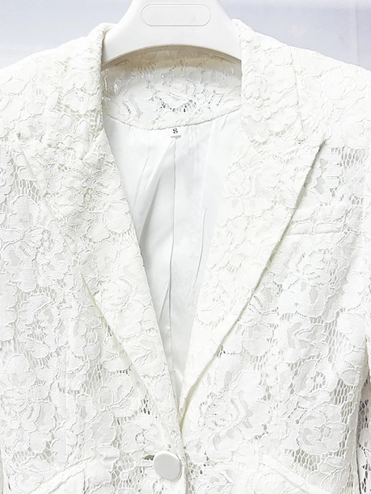White lace blazer on a mannequin against a light gray background