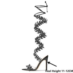 Close-up of crystal leaf lace-up stiletto sandals with heel height indicator