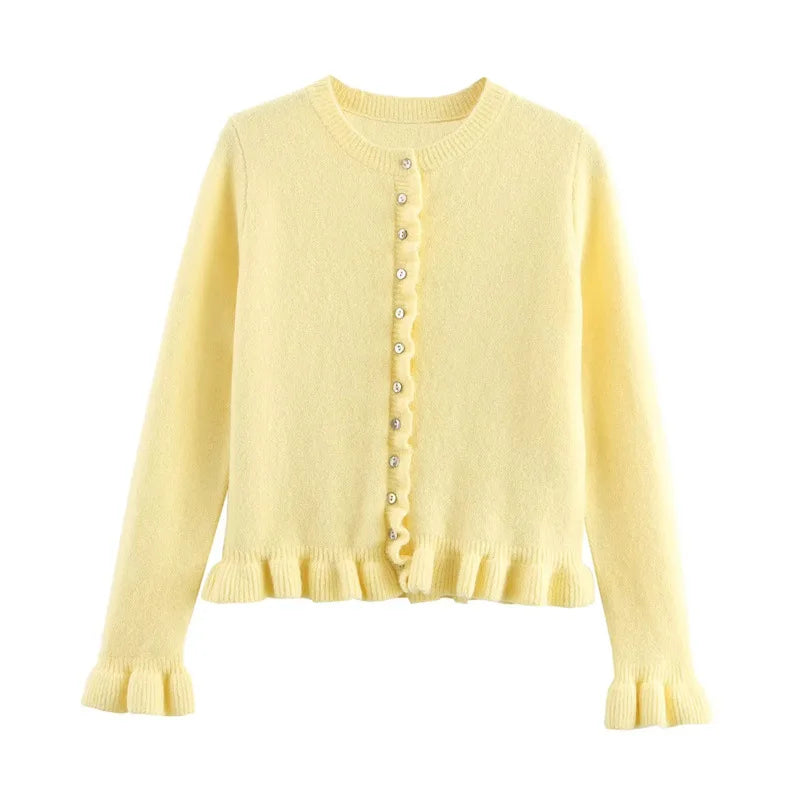 Yellow cardigan with buttons on a white background