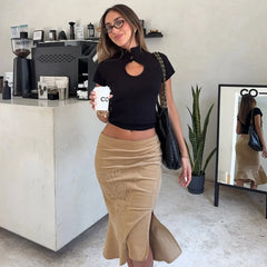 Woman holding a coffee cup in a cafe setting