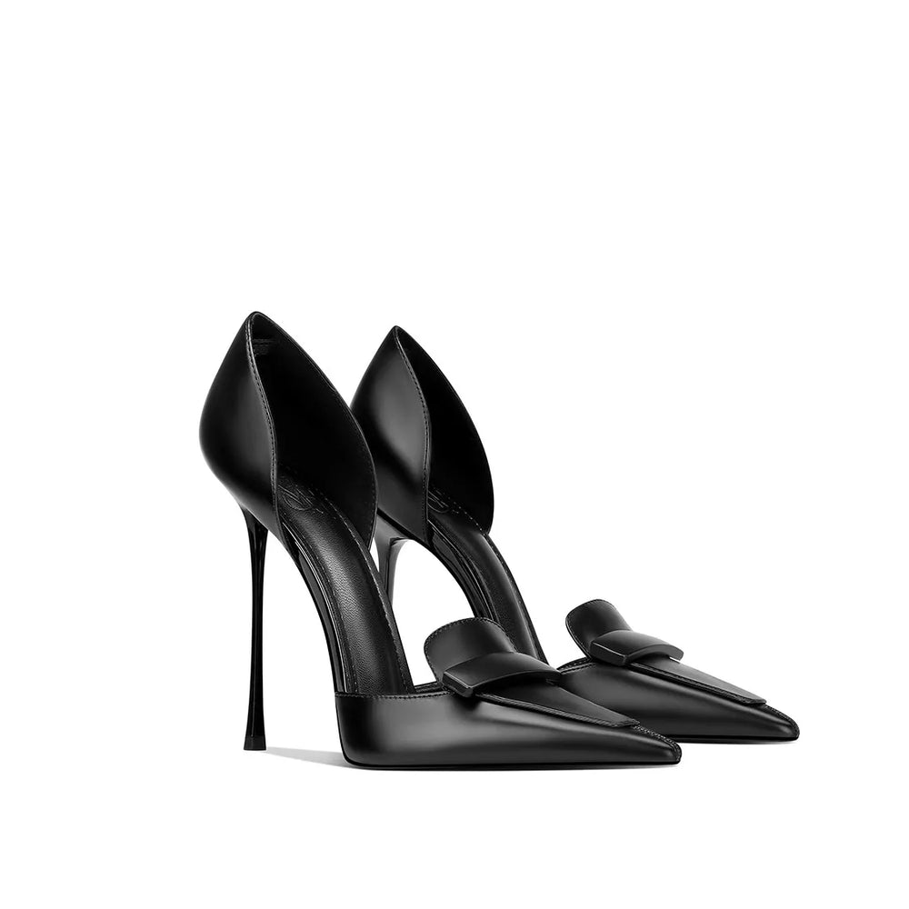 Black high-heeled shoes with pointed toes and bow details on a white background
