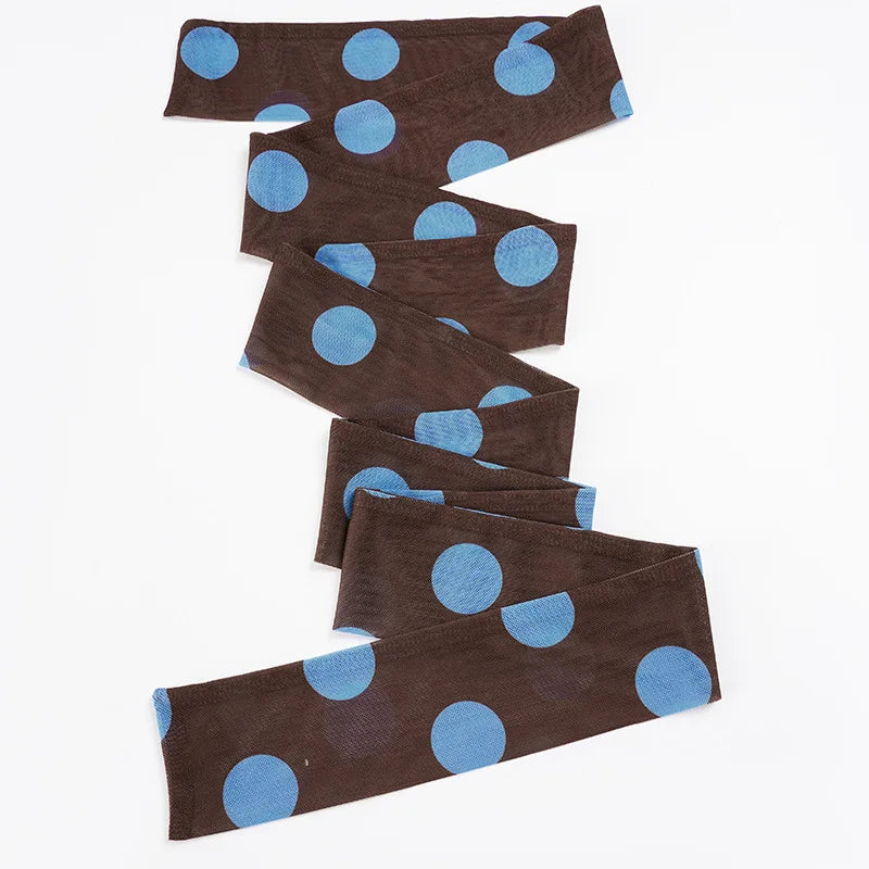 Brown headbands with blue polka dots arranged on a white background