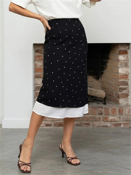 Polka dot midi skirt with a contrasting layered hem.