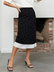 Polka dot midi skirt with a contrasting layered hem.