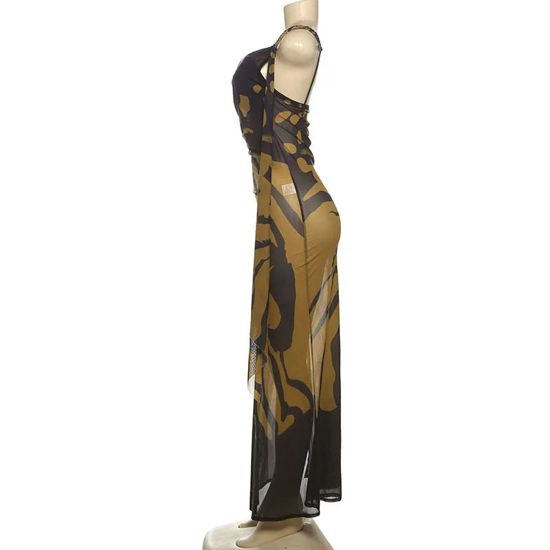Mannequin wearing a long, patterned dress on a white background