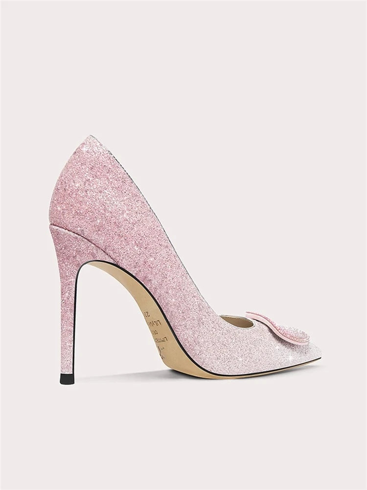 Pink glitter high heel shoe on a light gray background