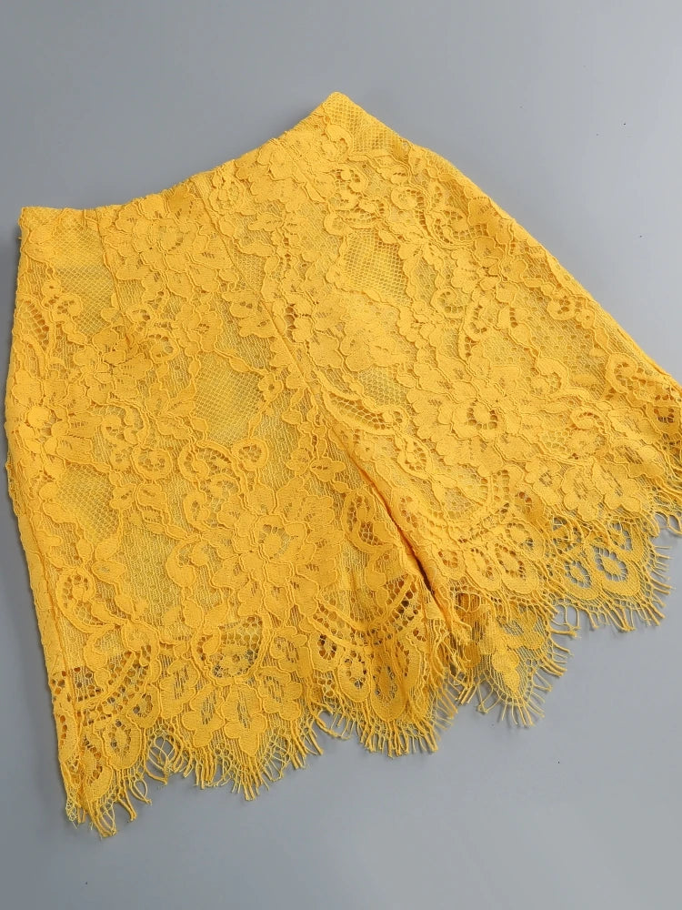 Yellow lace fabric on a gray background