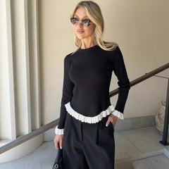 Ribbed knit top with ruffled trim detail