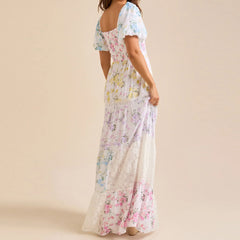 Woman wearing a floral dress on a beige background