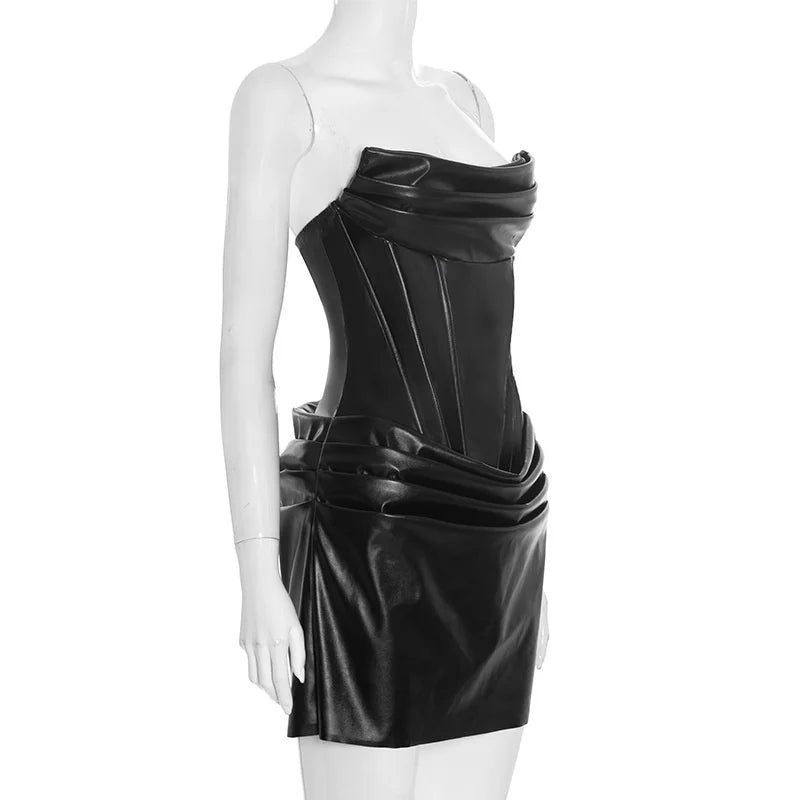 Black leather dress on a mannequin against a white background