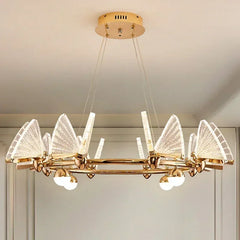 Gold chandelier with crystal-like design hanging from the ceiling.