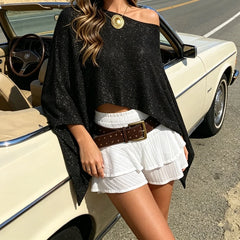 Shimmer asymmetrical poncho knitwear top with a classic car