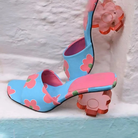 Blue floral print mule with a pink sole and clear acrylic flower heel