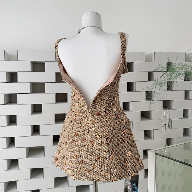 Back view of sequin mini dress with V-back zipper