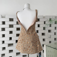 Back view of sequin mini dress with V-back zipper