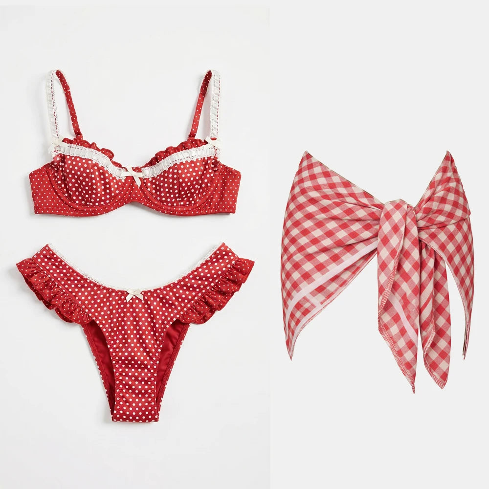 Red polka dot ruffled bikini and skirt set with white lace trim.