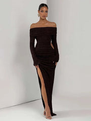 Woman wearing a dark brown off-shoulder dress with a high slit