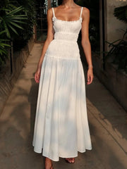 Woman wearing a white dress with a blurred background