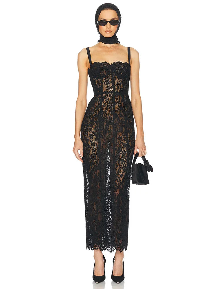 Woman wearing a black lace dress on a white background