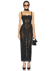 Woman wearing a black lace dress on a white background
