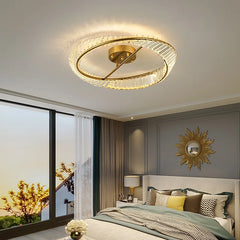 A bedroom with a glamorous crystal chandelier hanging above the bed, creating a relaxing ambiance.