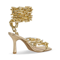 Side view of gold chain ankle-wrap stiletto sandals