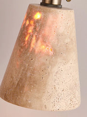  Close-up of the natural travertine stone texture and warm light emitted by the pendant light. Golden Atelier 3