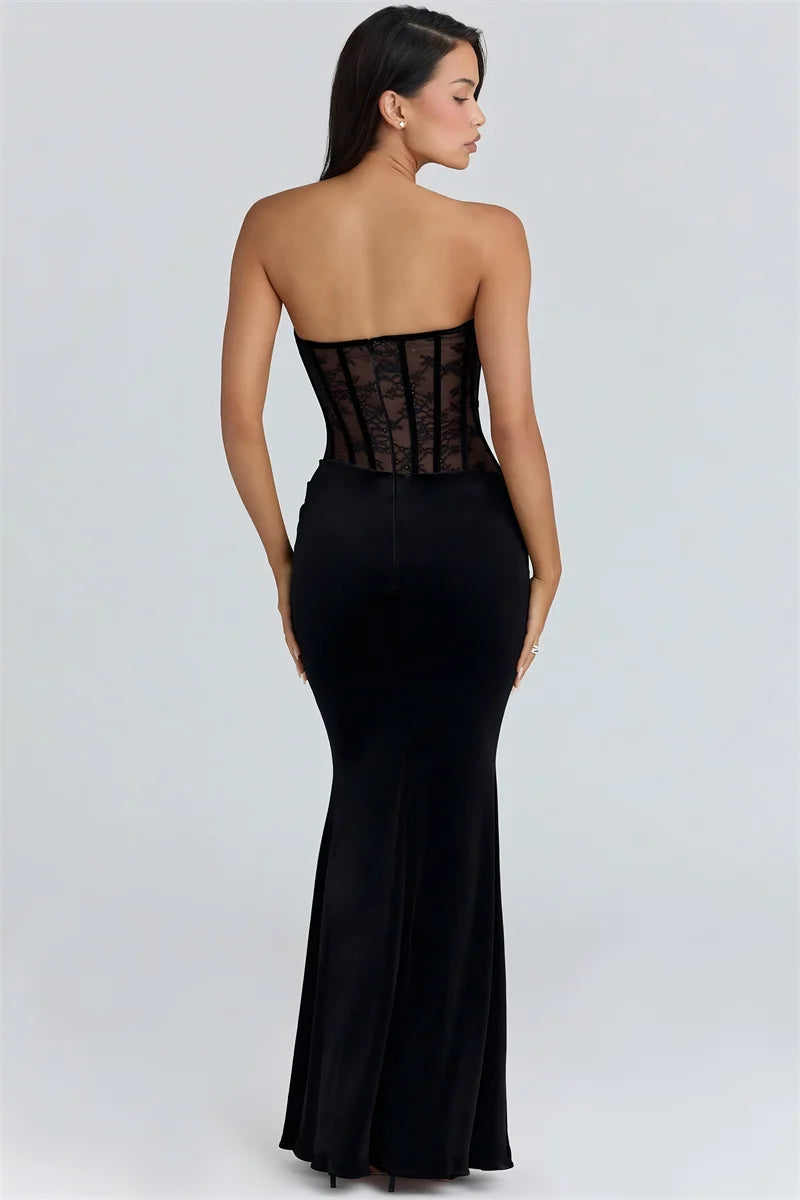 Black strapless gown with sheer back on a white background