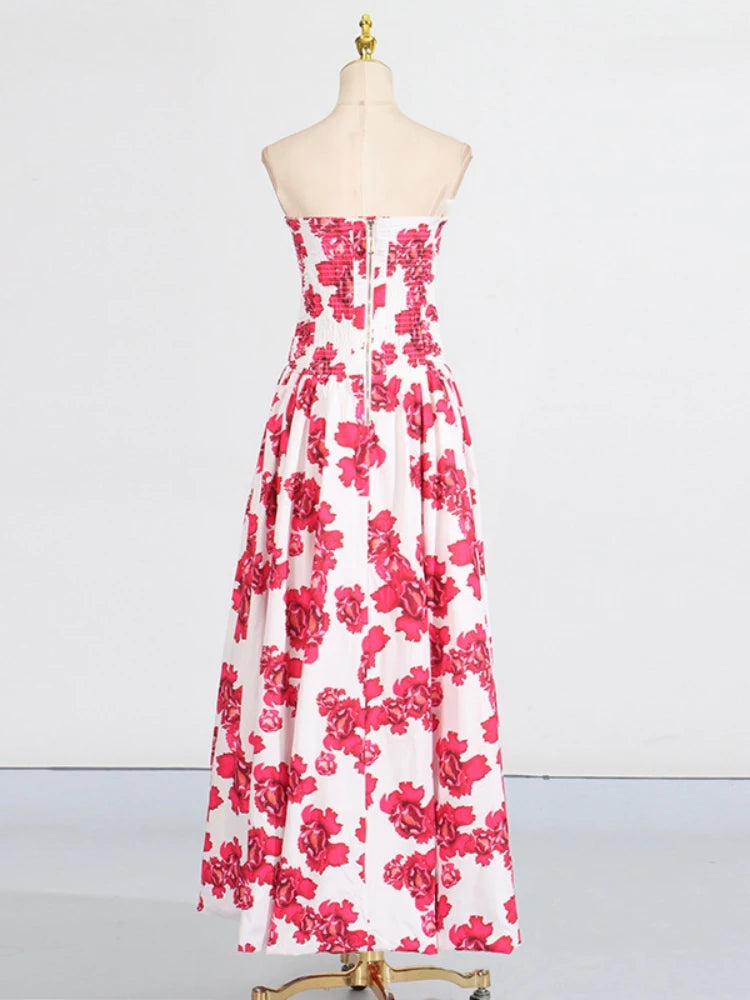 White strapless dress with pink floral pattern on a mannequin against a white background