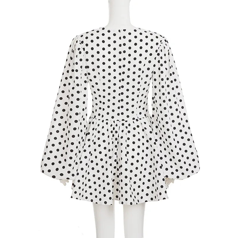 Polka dot dress on a mannequin against a white background