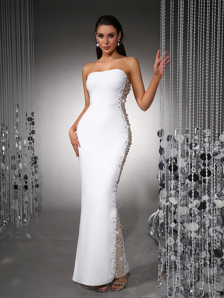 Strapless pearl embellished bodycon maxi dress with side mesh paneling and hand on hip