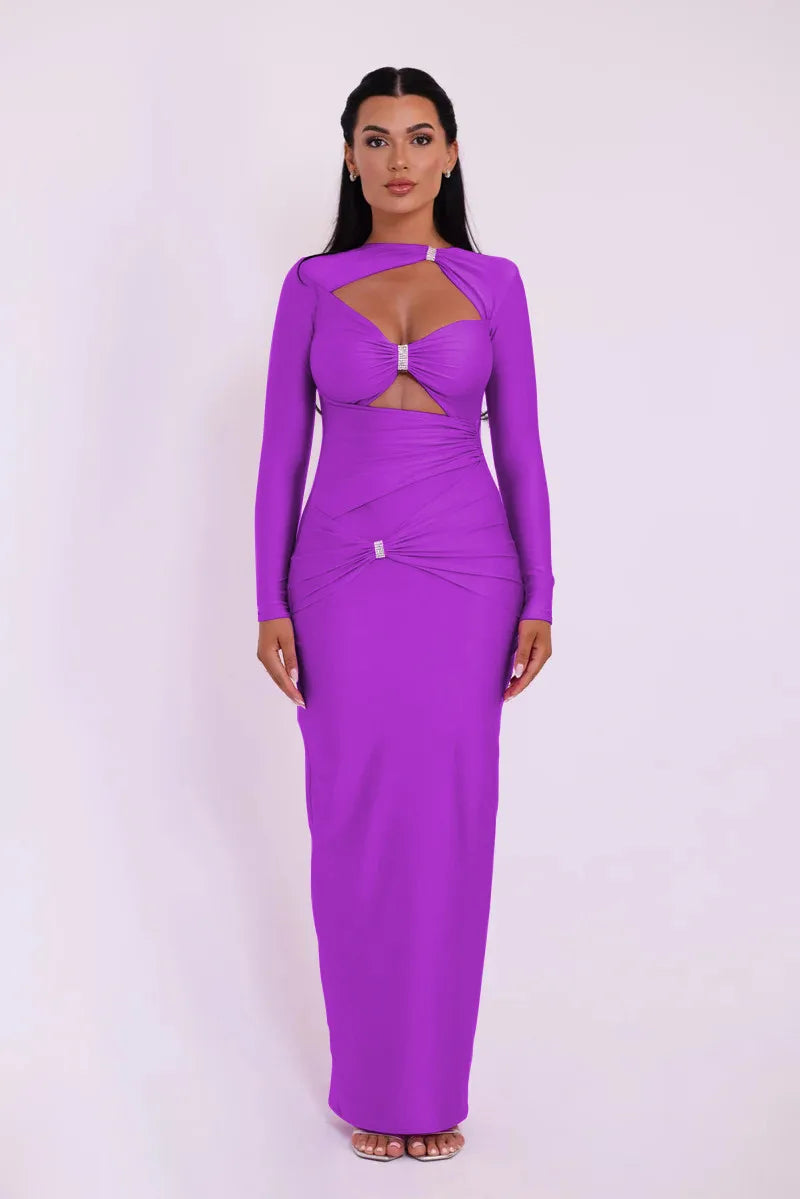 Woman wearing a purple dress with cut-out design on a white background