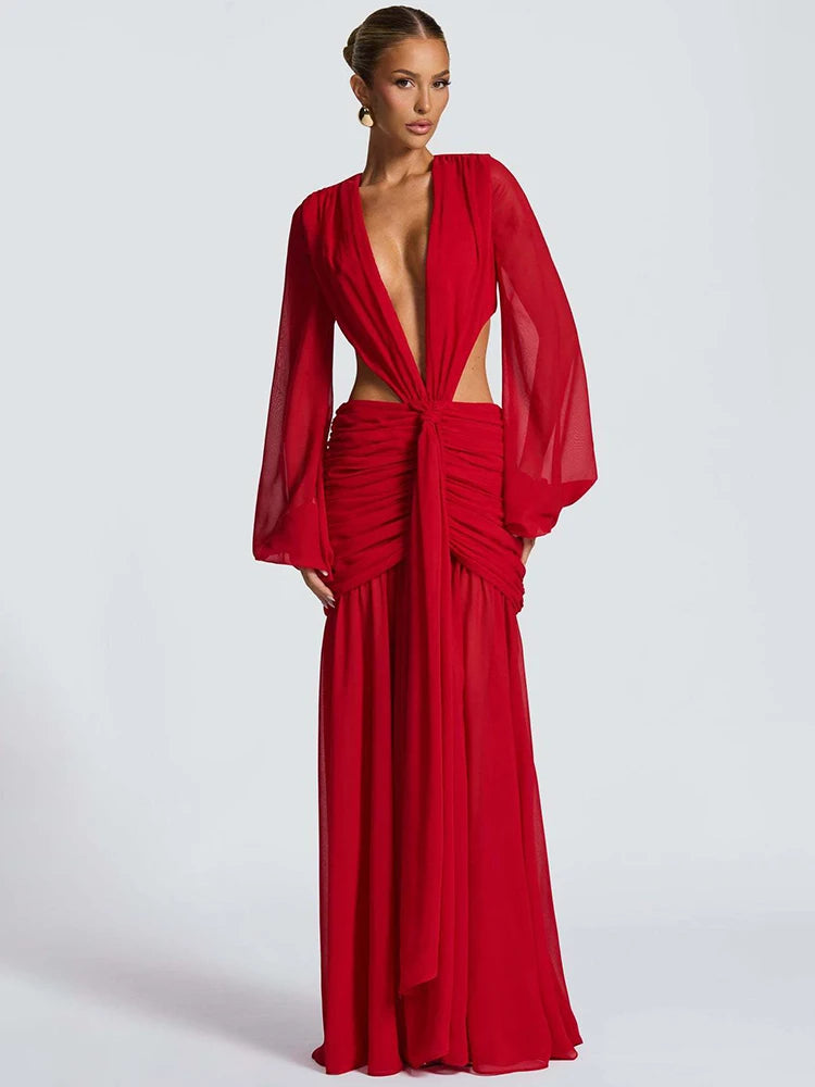 Red evening gown with sheer sleeves on a white background
