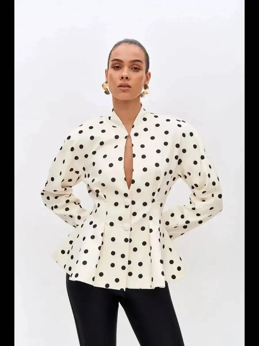 Front view of polka dot peplum blazer