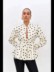 Front view of polka dot peplum blazer