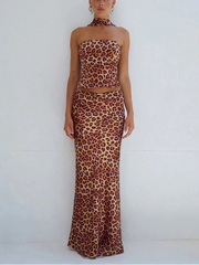 Woman wearing a leopard print dress on a white background