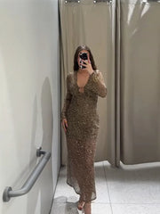 Model wearing sequined mesh v-neck midi dress