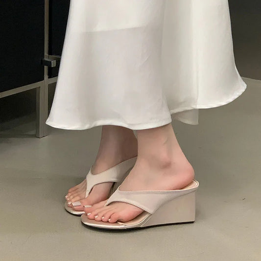 Wedge flip flop sandal on foot
