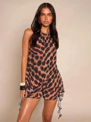 Leopard print halter neck crop top with ruffled shorts.
