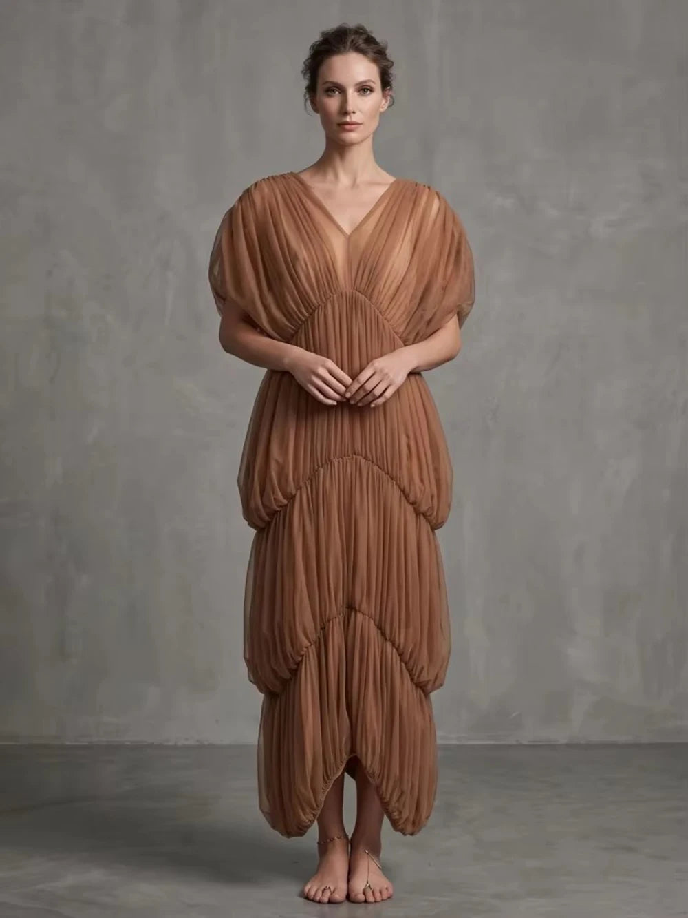 Gauze drape v-neck dress on model against grey backdrop