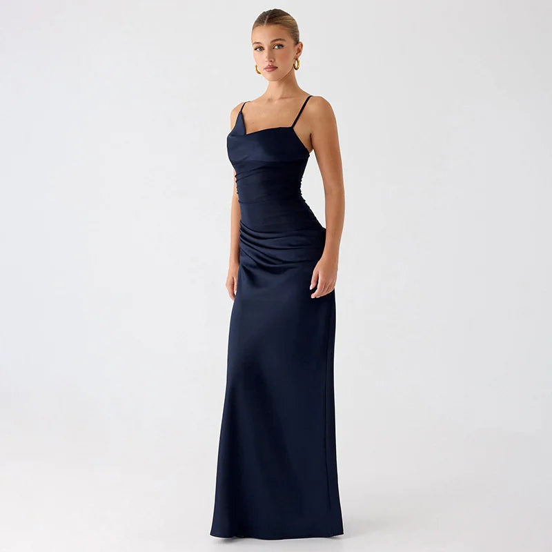 Woman wearing a navy blue evening gown on a white background