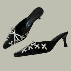  Pair of black pointed-toe slingback pumps with a delicate bow accent and low heel. Golden Atelier 3