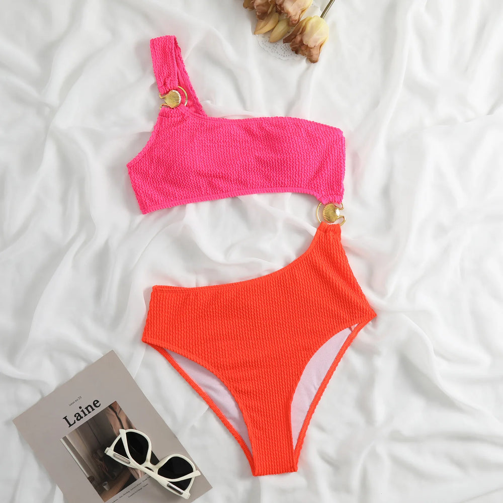 Ribbed one-piece swimsuit pink and orange laid flat