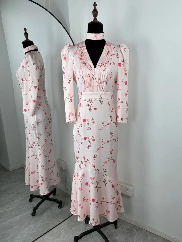 Floral dress on a mannequin against a white wall