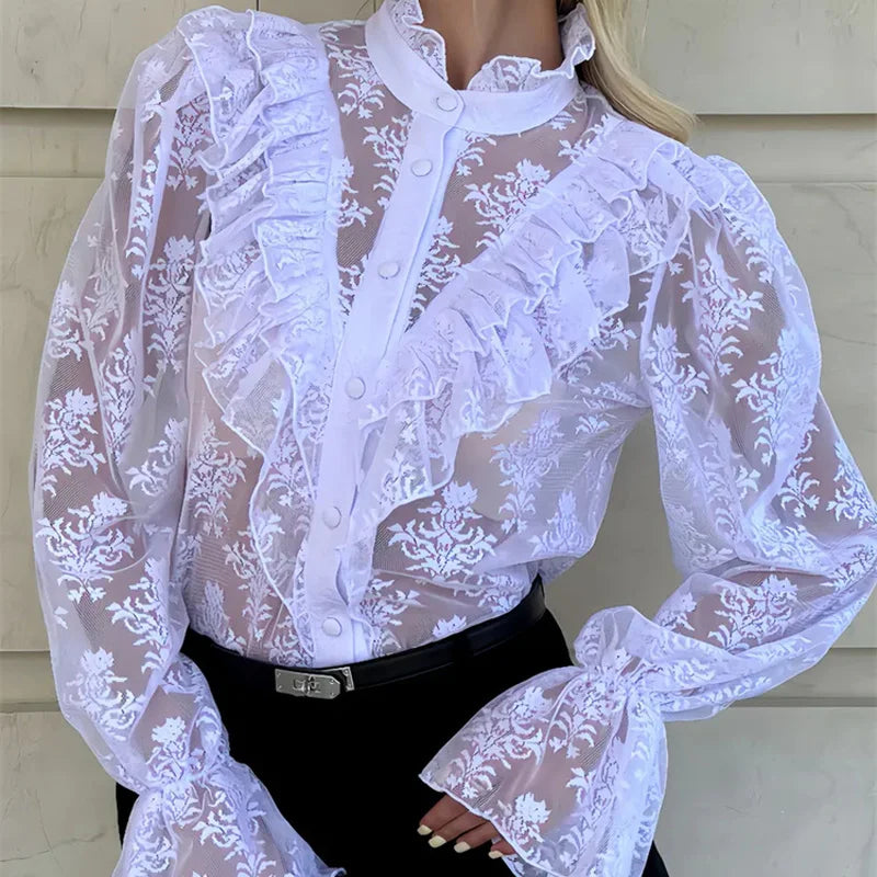 White lace blouse with long sleeves and a high collar on a neutral background