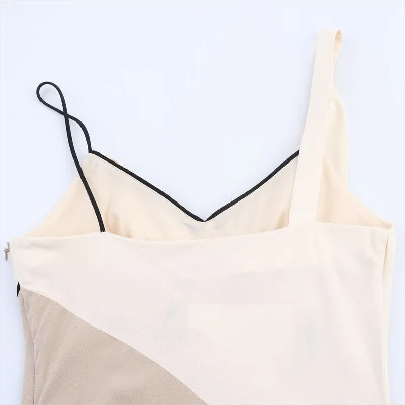 Beige spaghetti strap top on a light gray background