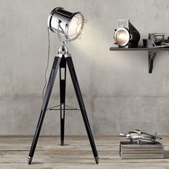 Modern Golden color steel floor lamp with a sleek design, standing in a brightly lit Studio room. Golden Atelier 4