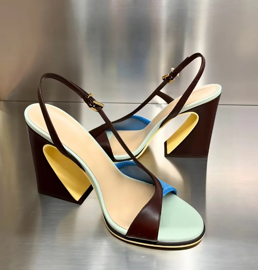 Colorblock slingback block heels displayed on a metallic surface.